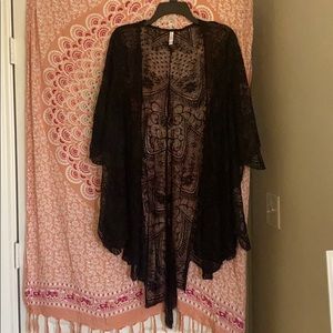 Lace black cardigan. Very pretty over any tank top